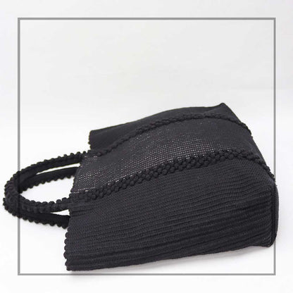 BLACK AND SILVER TOTE - LISCIA TRO - side view -Ethical and Sustainable Handbags. The best eco luxury bags and accessories brand. Stylish clothes and Eco-Friendly with recycled yarns #luxury #ecoconcious #sustainablestyle #ethicalbrands #ethicalhandbags #handbags #sustainablelifestyle #ethicalfashion #sustainability