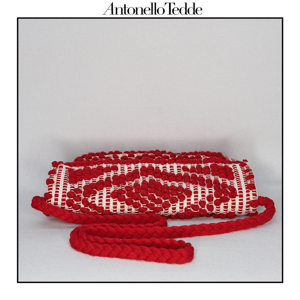 Top view of the Red and Cream ground beloved style within the Antonello Tedde collection, the Suni Rombi Clutch cross-body. The bag is celebrated for its effortless blend of elegance, function, and sustainable craftsmanship.