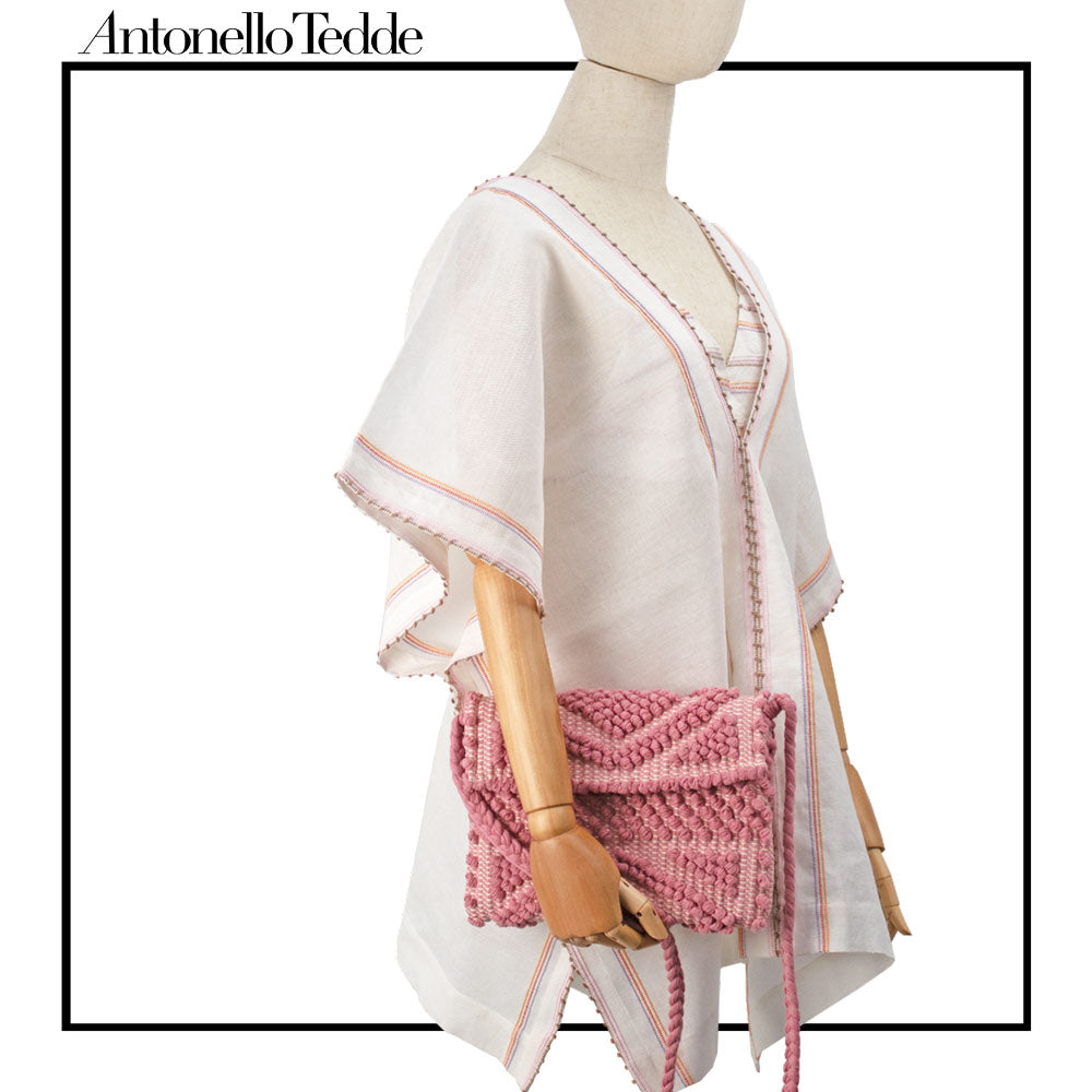 Handwoven cotton crossbody bag in pink, perfect for spring-summer looks in 2025.