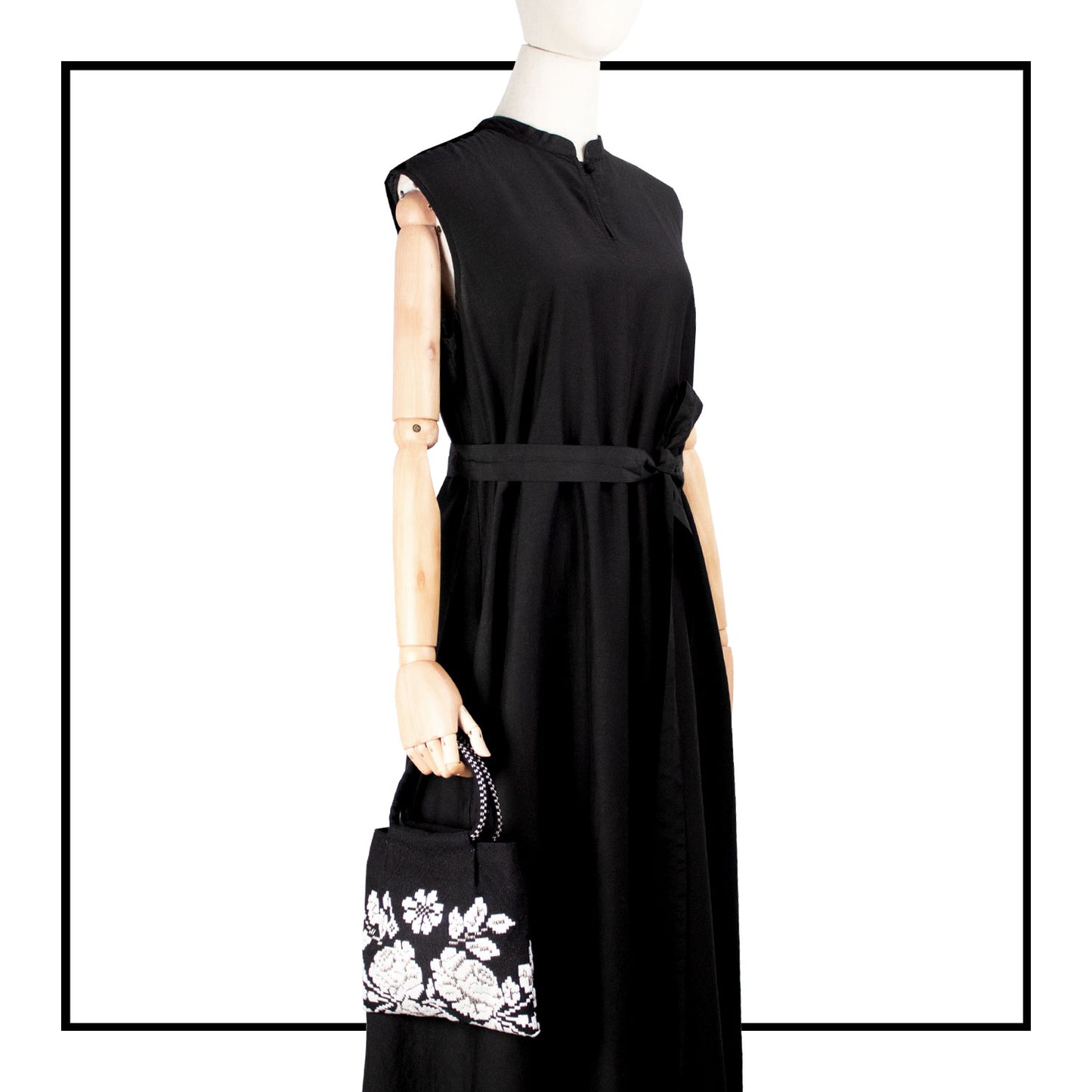 on model view for the black and white evening bag to complete your look with our selection of accessories crafted with the environment in mind
