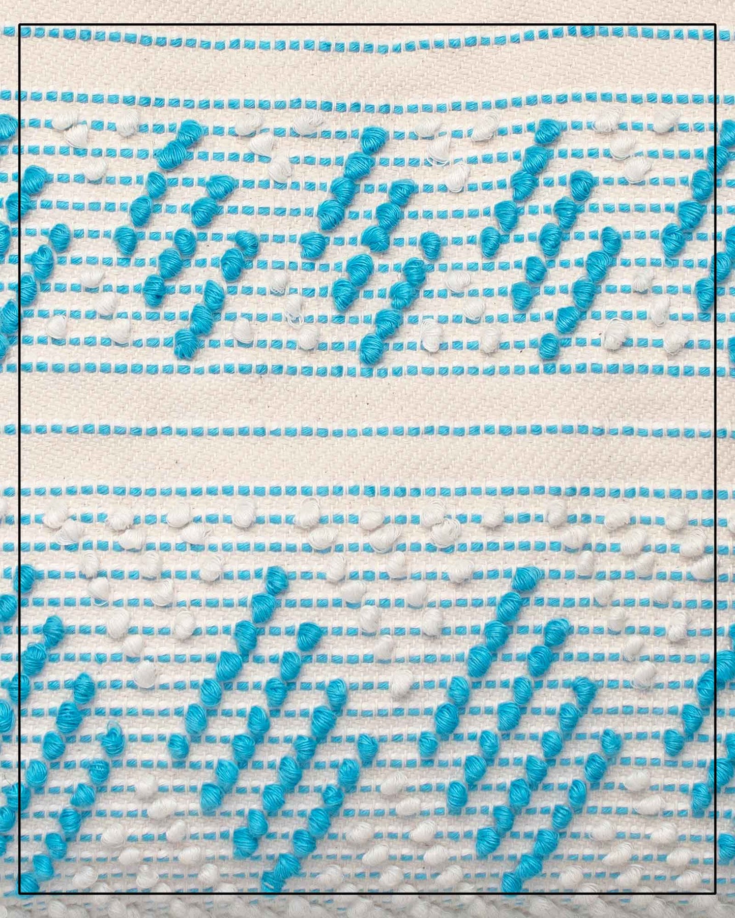 Antonello Tedde Mugoni Zig Zag Tote Bag, handwoven in Sardinia from linen and cotton with geometric zig zag weave and diamond motifs - close up view of tote bag with turquoise on a cream background