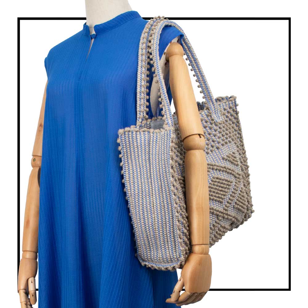 CORD LINEN _SKYBLUE BASE medium tote on MODEL closeup view to complete your look with our selection of accessories crafted with the environment in mind