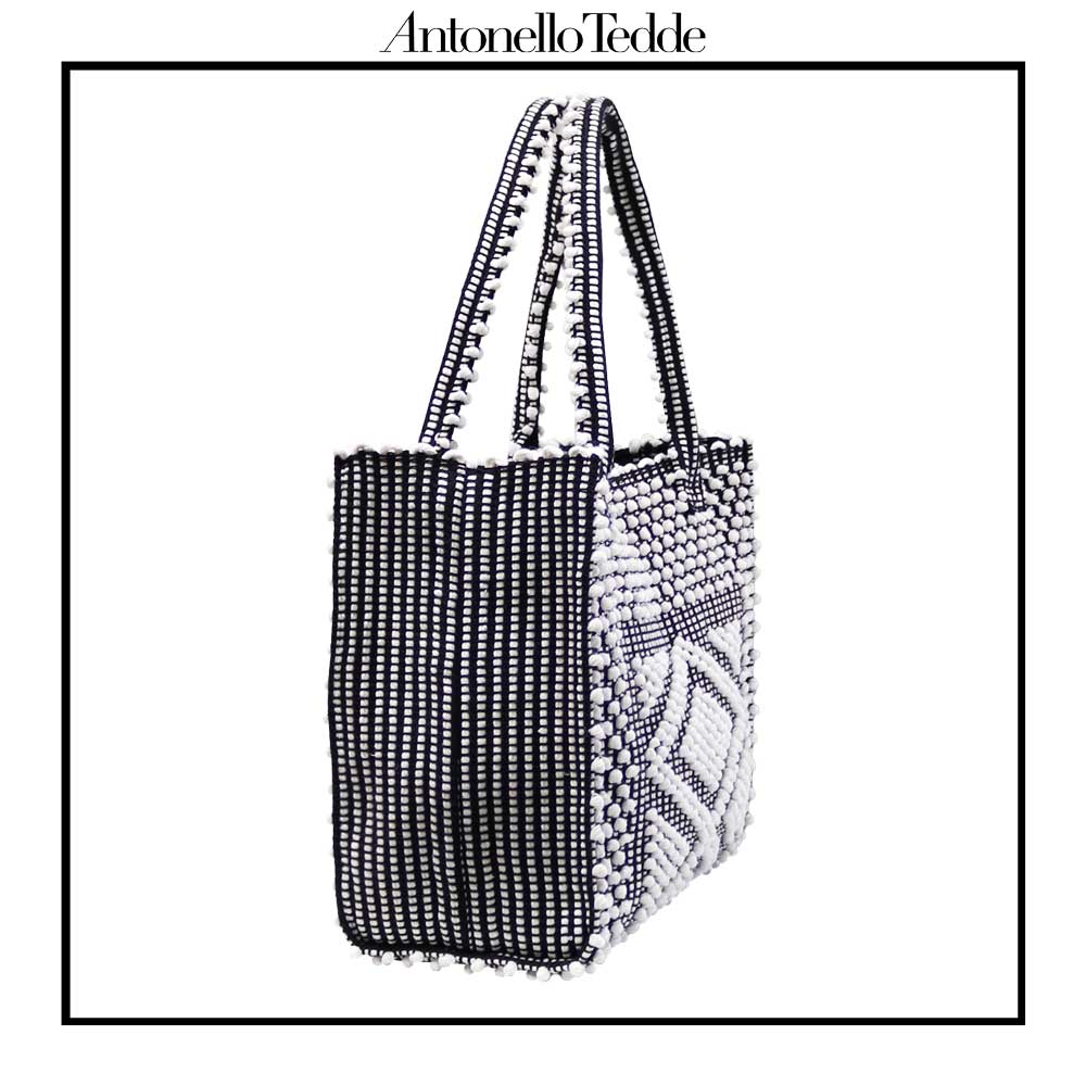 SIDE VIEW of the black and white tote bag. Sustainable tote - summer bag - luxury handbag - handwoven black and white tote made in Italy by hand • timeless individualistic fashion • eco-friendly fashion • socially responsible, lasting fashion