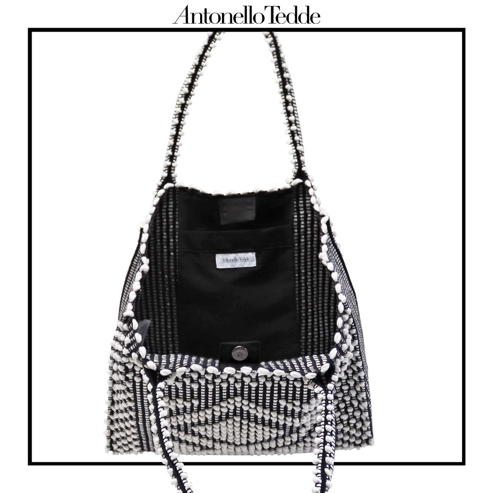 POCKET VIEW of the black and white tote bag. Sustainable tote - summer bag - luxury handbag - handwoven black and white tote made in Italy by hand • timeless individualistic fashion • eco-friendly fashion • socially responsible, lasting fashion