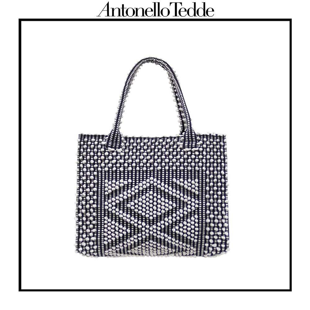 Main frontal view of the black and white tote bag. Sustainable tote - summer bag - luxury handbag - handwoven black and white tote made in Italy by hand • timeless individualistic fashion • eco-friendly fashion • socially responsible, lasting fashion