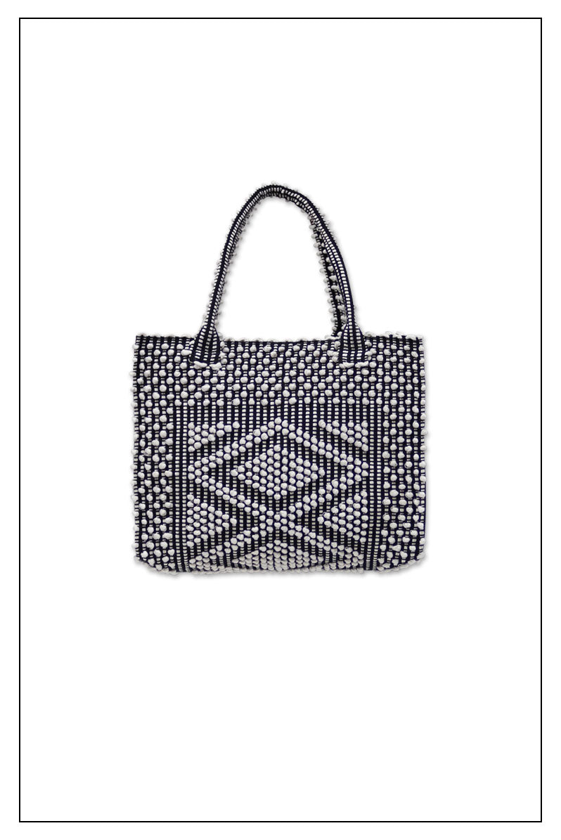 FRONT VIEW of the black and white tote bag. Sustainable tote - summer bag - luxury handbag - handwoven black and white tote made in Italy by hand • timeless individualistic fashion • eco-friendly fashion • socially responsible, lasting fashion