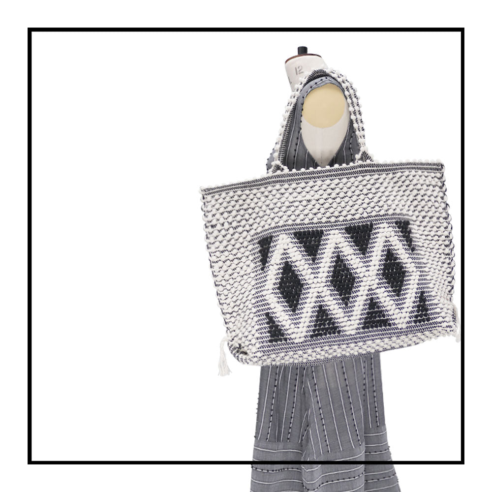 Tote on Model - Sustainable tote - summer bag - luxury handbag - handwoven black and white tote made in Italy by hand • timeless individualistic fashion • eco-friendly fashion • socially responsible, lasting fashion,
