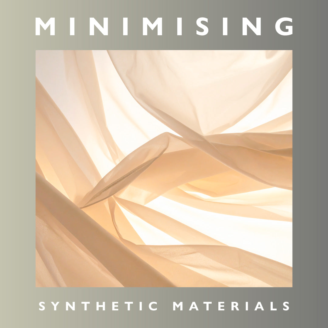 Text 'MINIMISING SYNTHETIC MATERIALS' over abstract beige and white pattern. A lightweight, natural fabric gently moving in sunlight, illustrating the breathability of materials for warm-weather travel.