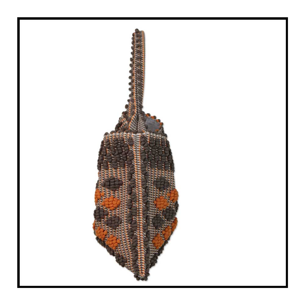 Side view of Quality eco-conscious hobo bag handwoven orange and taupe. Stylish clothes and Eco-Friendly with recycled yarns #luxury #ecoconcious #sustainablestyle  #ethicalbrands #ecoliving  #ecofashion #ecostyle #ethicalhandbags #handbags #sustainablelifestyle #ethicalfashion #sustainability