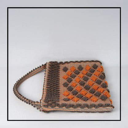 Flat view of Quality eco-conscious hobo bag handwoven orange and taupe. Stylish clothes and Eco-Friendly with recycled yarns #luxury #ecoconcious #sustainablestyle  #ethicalbrands #ecoliving  #ecofashion #ecostyle #ethicalhandbags #handbags #sustainablelifestyle #ethicalfashion #sustainability