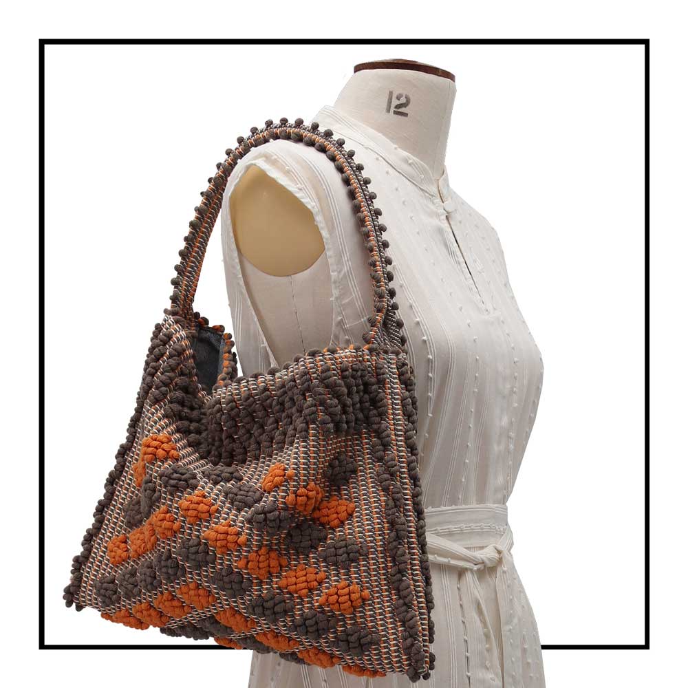Detailed On stand, size 12, side view of Quality eco-conscious hobo bag handwoven orange and taupe. Stylish clothes and Eco-Friendly with recycled yarns #luxury #ecoconcious #sustainablestyle  #ethicalbrands #ecoliving  #ecofashion #ecostyle #ethicalhandbags #handbags #sustainablelifestyle #ethicalfashion #sustainability