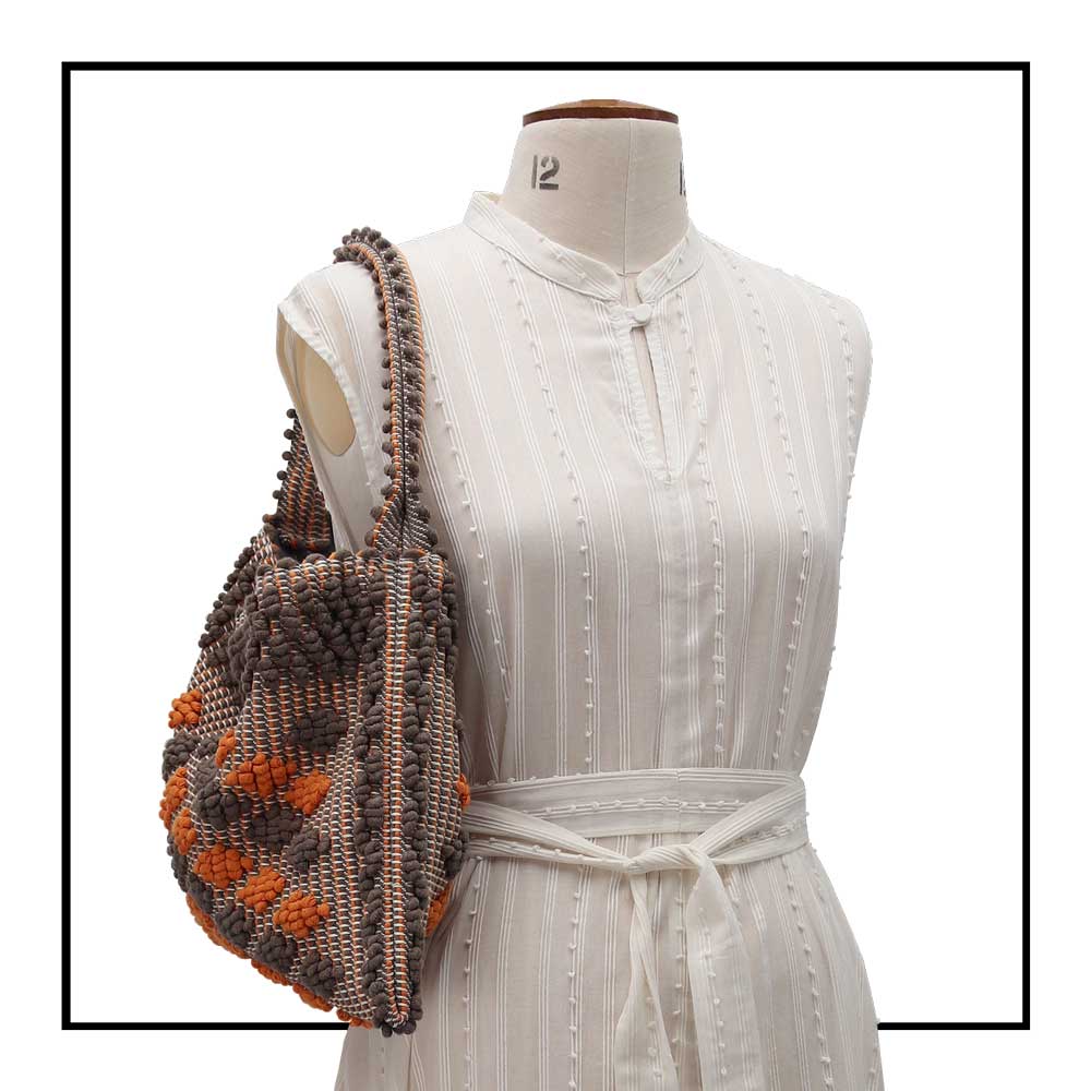Detailed On stand, size 12 view, front of Quality eco-conscious hobo bag handwoven orange and taupe. Stylish clothes and Eco-Friendly with recycled yarns #luxury #ecoconcious #sustainablestyle  #ethicalbrands #ecoliving  #ecofashion #ecostyle #ethicalhandbags #handbags #sustainablelifestyle #ethicalfashion #sustainability