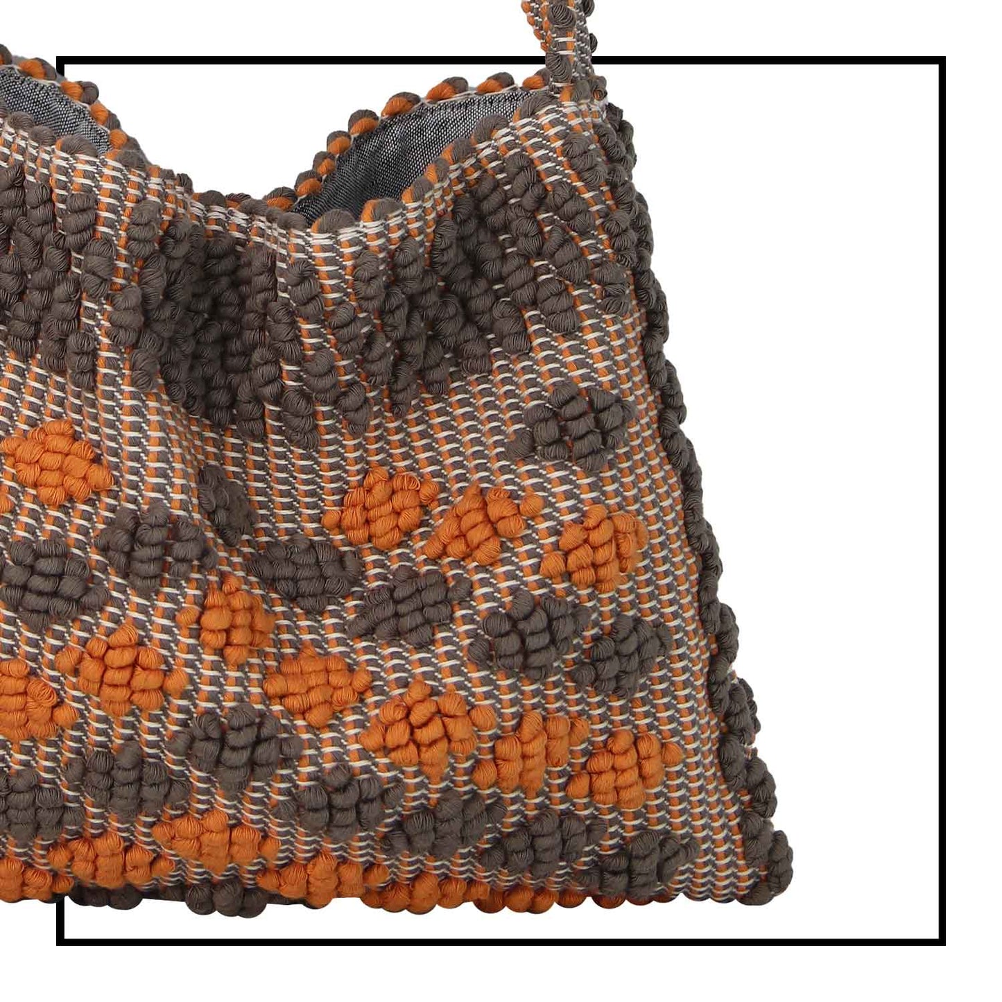 Close up fabric view of Quality eco-conscious hobo bag handwoven orange and taupe. Stylish clothes and Eco-Friendly with recycled yarns #luxury #ecoconcious #sustainablestyle  #ethicalbrands #ecoliving  #ecofashion #ecostyle #ethicalhandbags #handbags #sustainablelifestyle #ethicalfashion #sustainability