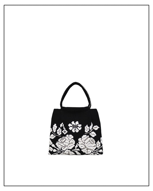 Black handbag with white floral embroidery on a white background - ANTONELLO TEDDE black and white evening bag to complete your look, with our selection of accessories crafted with the environment in mind