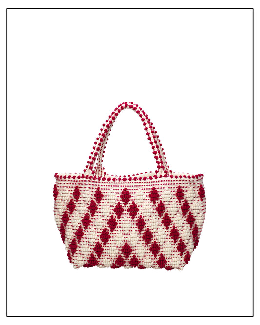 Antonello Tedde Red-and-white patterned handbag on a white background. Celvia Medium Red and Cream Tote Bag is handwoven, a reimagined classic that marks the return of the beloved rombetti (Multiple Diamonds) pattern in a fresh, contemporary silhouette