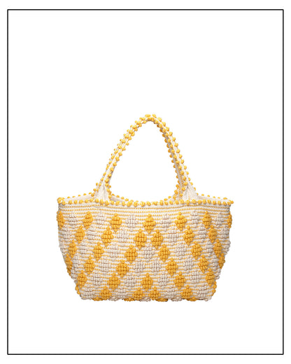 Antonello Tedde's Yellow-and-Cream patterned handbag on a white background. Celvia Medium Red and Cream Tote Bag is handwoven, a reimagined classic that marks the return of the beloved rombetti (Multiple Diamonds) pattern in a fresh, contemporary silhouette