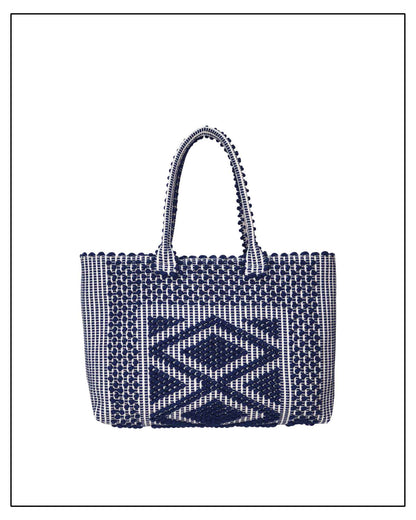 Antonello Tedde's woven handbag with geometric pattern on a white background. Front view 