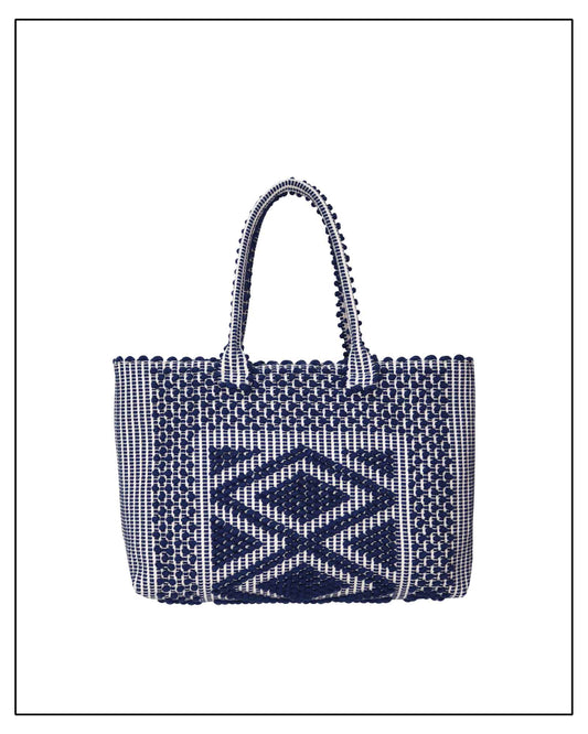 Antonello Tedde's woven handbag with geometric pattern on a white background. Front view 