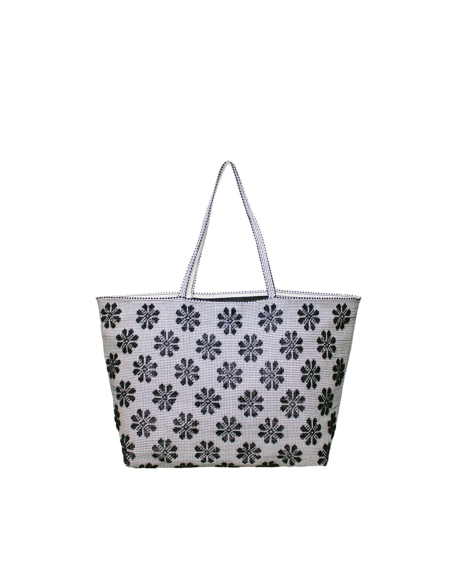 Tote bag with black floral pattern on a white background. Front view of a black and white tote bag with a daisy pattern. Main view of our Sustainable tote - summer bag - luxury handbag - handwoven made in Italy by hand  - timeless individualistic fashion • eco-friendly fashion • socially responsible, lasting fashion.