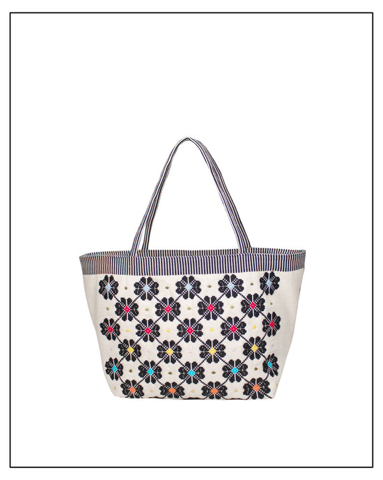 Antonello Tedde entirely hand-woven fabric tote with black flowers with colourful centre on black and white background - handmade in Sardinia, Italy  