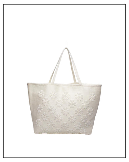 Frontal view of a handwoven cream tote bag, all by Antonello Tedde