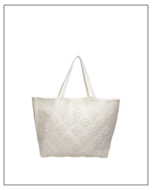 Frontal view of a handwoven cream tote bag, all by Antonello Tedde