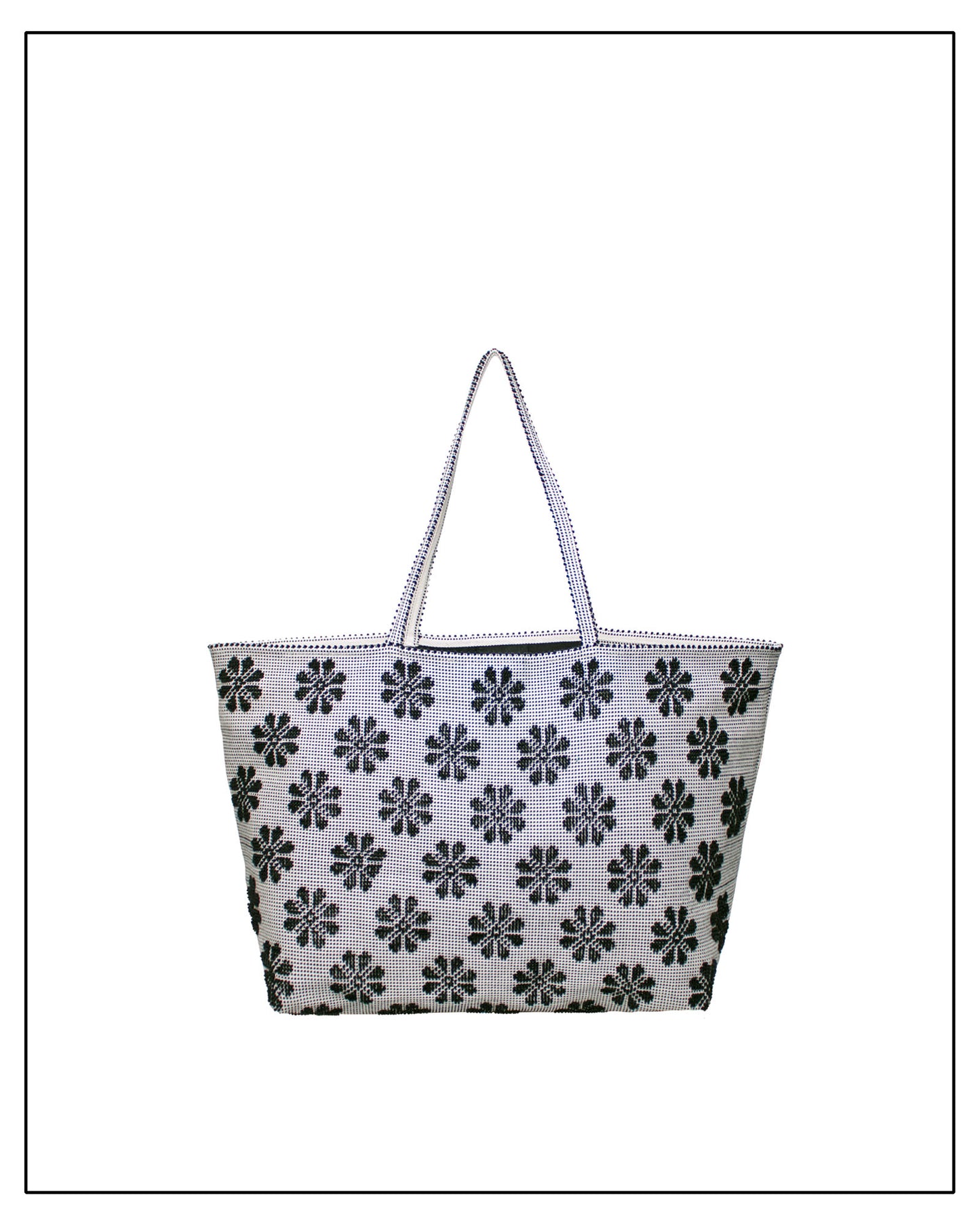 Tote bag with black floral pattern on a white background. Front view of a black and white tote bag with a daisy pattern. Main view of our Sustainable tote - summer bag - luxury handbag - handwoven made in Italy by hand  - timeless individualistic fashion • eco-friendly fashion • socially responsible, lasting fashion.