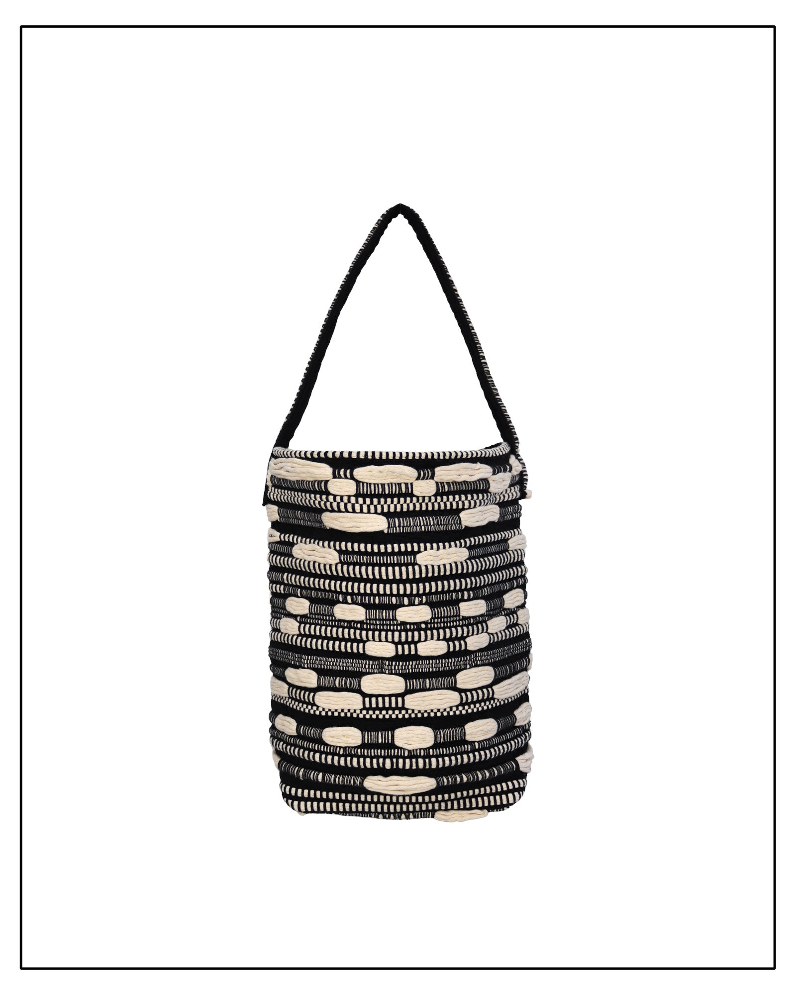Main View of Antonello Tedde Bultei Tote Bag from the Trame in Fuga Collection, handwoven in Sardinia with black and natural cotton, textured woven motifs, and artisanal craftsmanship.