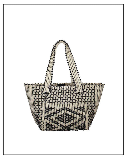 Antonello Tedde Pula Medium Tote Bag is handwoven in Sardinia with black and golden yarn, a diamond pattern, and a practical flap pocket. 