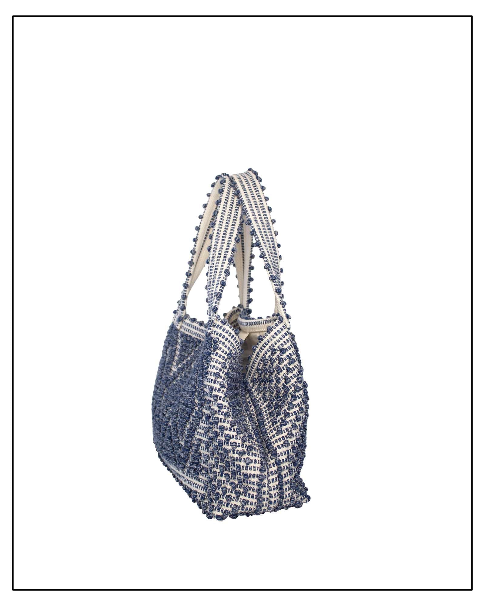 Side view of Woven handbag with blue and white pattern on a white background - Front view of Antonello Tedde Celvia Medium Tote Bag in handwoven melange blue cotton with large diamond rombi pattern