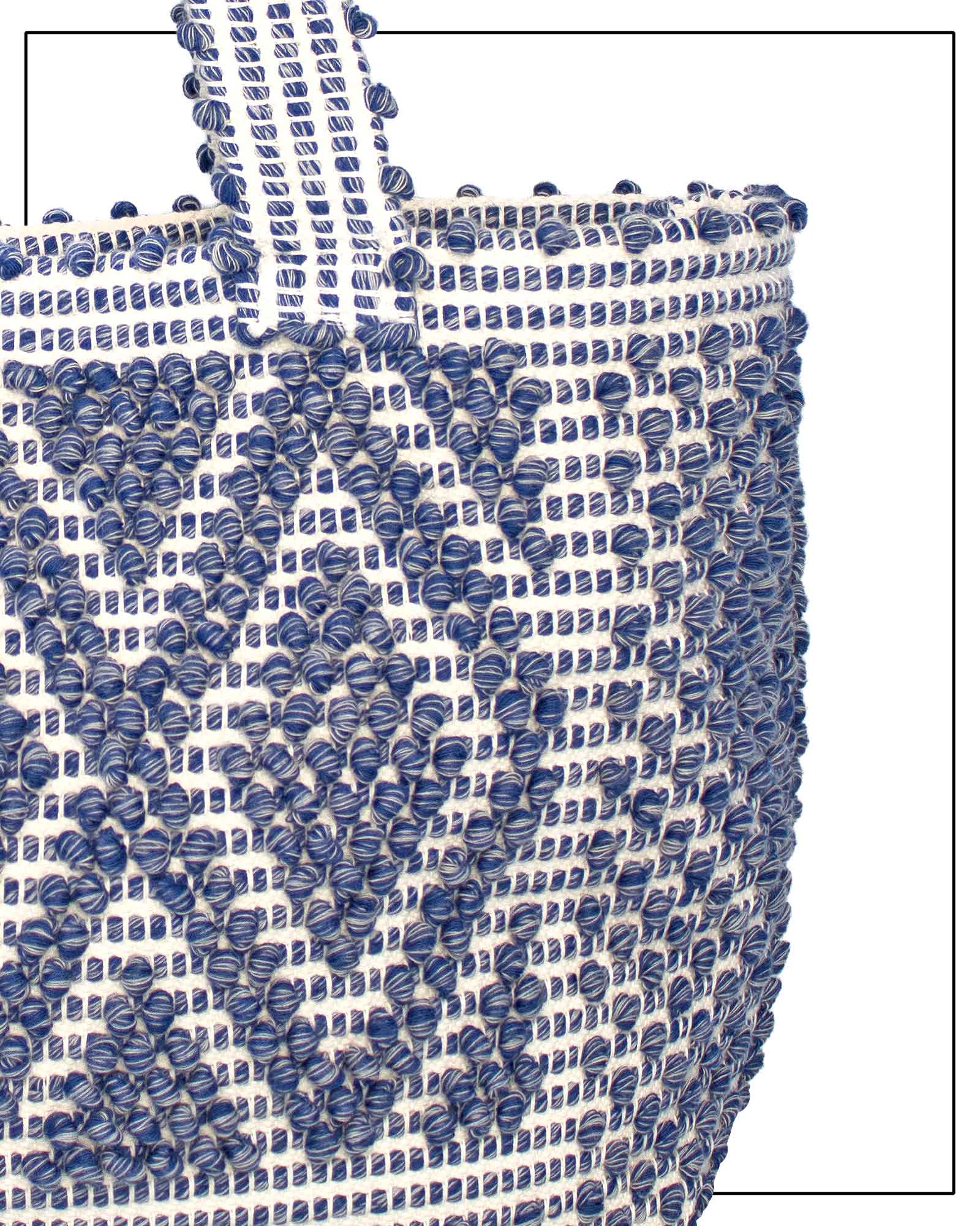 detail view of Woven handbag with blue and white pattern on a white background - Front view of Antonello Tedde Celvia Medium Tote Bag in handwoven melange blue cotton with large diamond rombi pattern