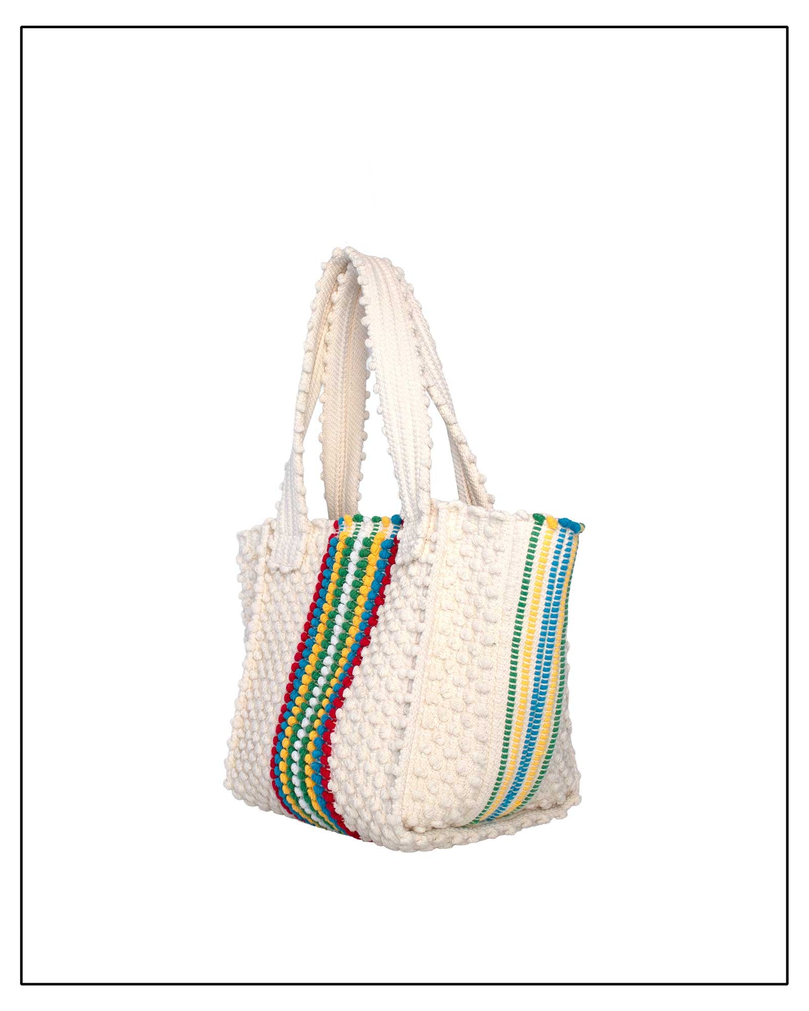 Side View of White woven bag with colourful striped pattern on a white background - Pula Medium Tote Bag, a reimagined classic that marks the return of the beloved striscie (stripes) pattern in a fresh, contemporary silhouette.