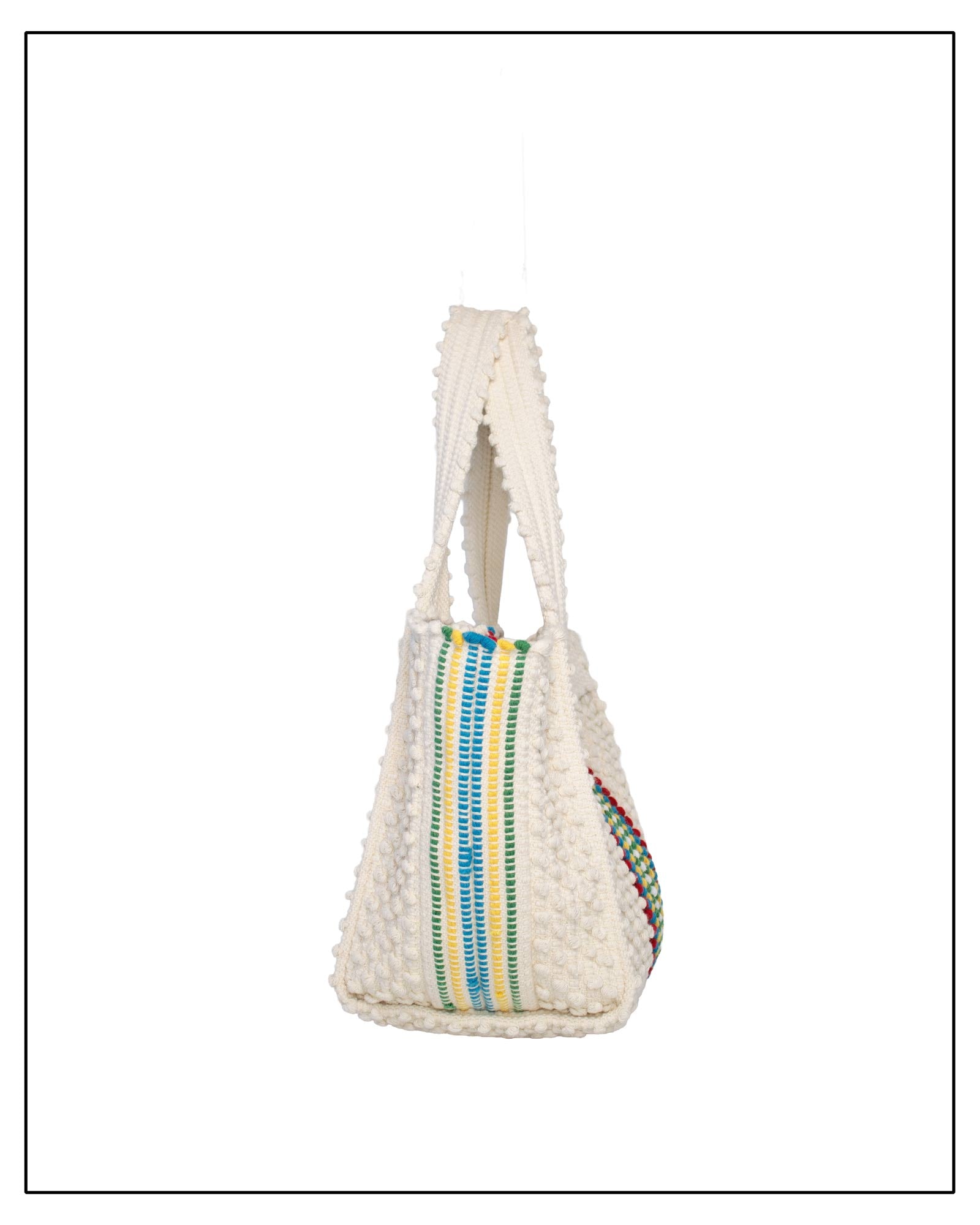 Side View of Woven handbag with colourful stripes on a white background - Pula Medium Tote Bag, a reimagined classic that marks the return of the beloved striscie (stripes) pattern in a fresh, contemporary silhouette.