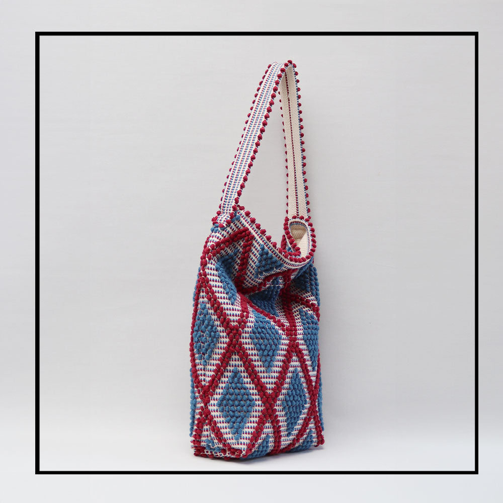 SEMI FOLDED  SIDE VIEW BURGUNDY and DENIM/base CREAM bucket bag to complete your look with our selection of accessories crafted with the environment in mind