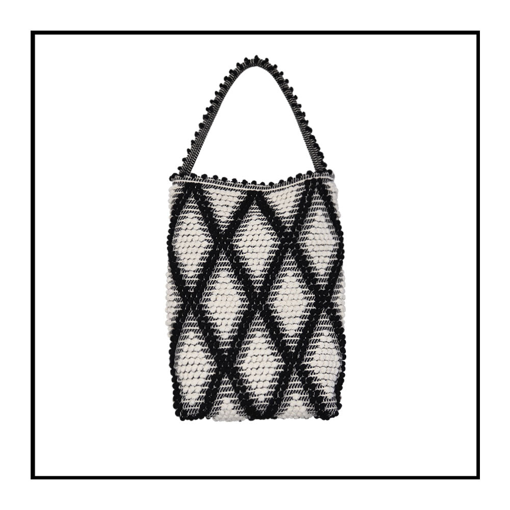BLACK AND WHITE bucket bag to complete your look with our selection of accessories crafted with the environment in mind
