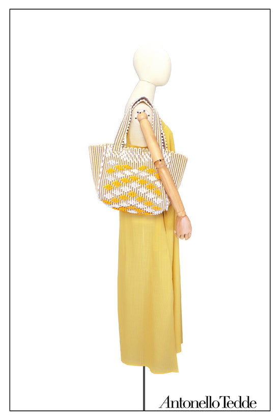On Model full view of tote with square tote bag with DIAMONDS ROMBETTI in yellow and cream. The best eco luxury bags and accessories brand. Stylish clothes and Eco-Friendly with recycled yarns