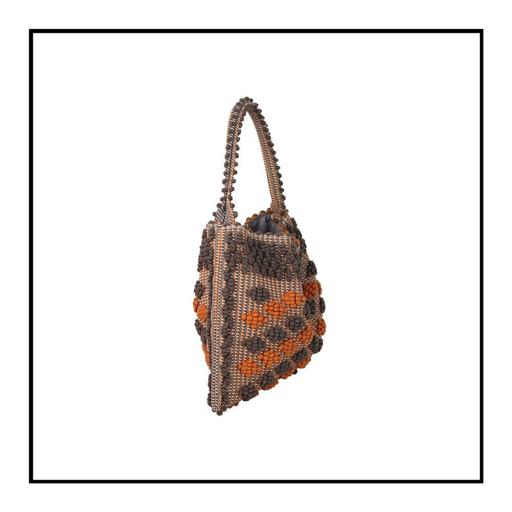 Side view of Quality eco-conscious hobo bag handwoven orange and taupe. Stylish clothes and Eco-Friendly with recycled yarns #luxury #ecoconcious #sustainablestyle  #ethicalbrands #ecoliving  #ecofashion #ecostyle #ethicalhandbags #handbags #sustainablelifestyle #ethicalfashion #sustainability