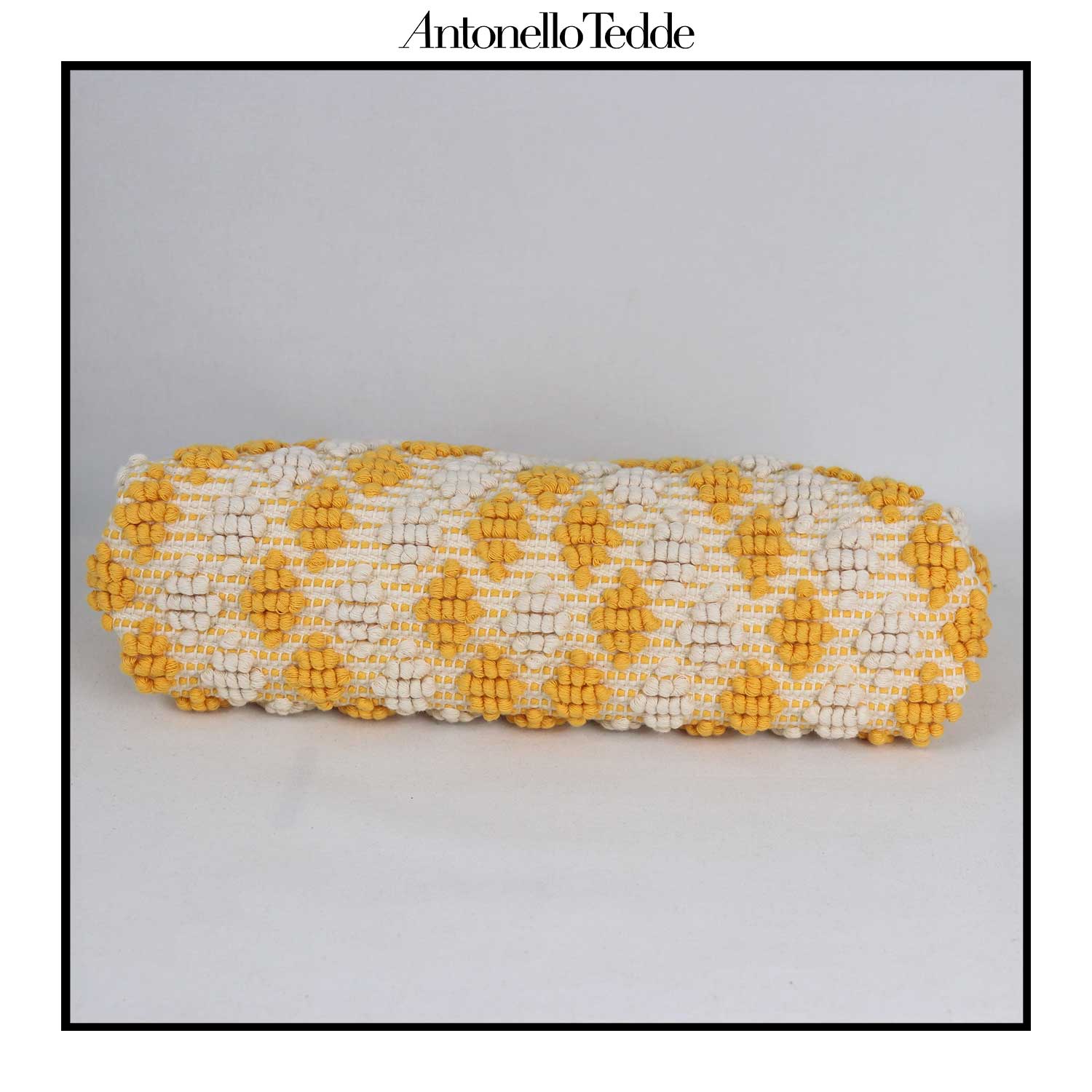 Base view of the Piatta Clutch Zip Bag, yellow and cream, sleek and sophisticated accessory designed for modern elegance. This compact clutch combines minimalist design with exceptional craftsmanship, making it a versatile companion for any occasion.
