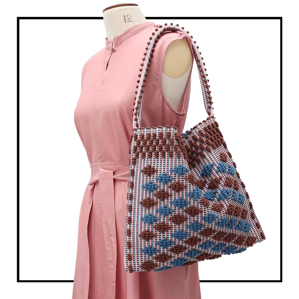On mannequin our quality eco-conscious hobo bag handwoven Hazelnut and Denim little diamonds . Stylish clothes and Eco-Friendly with recycled yarns #luxury #ecoconcious #sustainablestyle #ethicalbrands #ecoliving #ecofashion #ecostyle #ethicalhandbags #handbags #sustainablelifestyle #ethicalfashion #sustainability