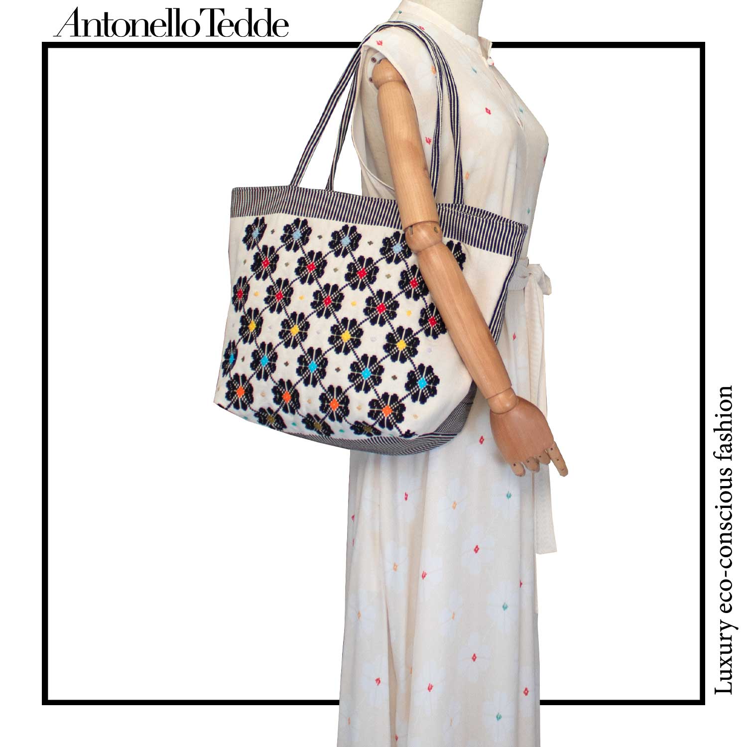 On model view of a black and white tote bag with a daisies pattern. Main view of our Sustainable tote - summer bag - luxury handbag - handwoven made in Italy by hand  - timeless individualistic fashion • eco-friendly fashion • socially responsible, lasting fashion.