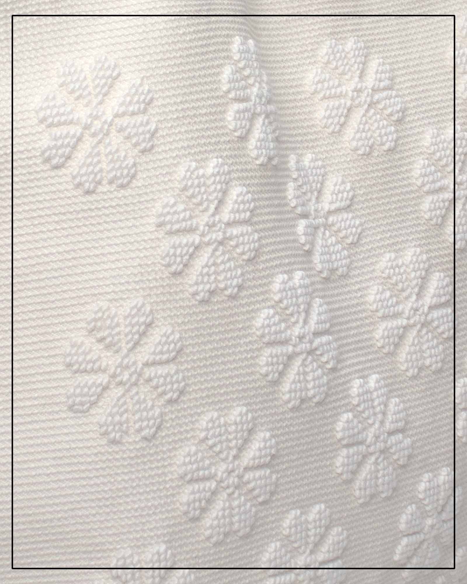 Textured white fabric with floral patterns by Antonello Tedde