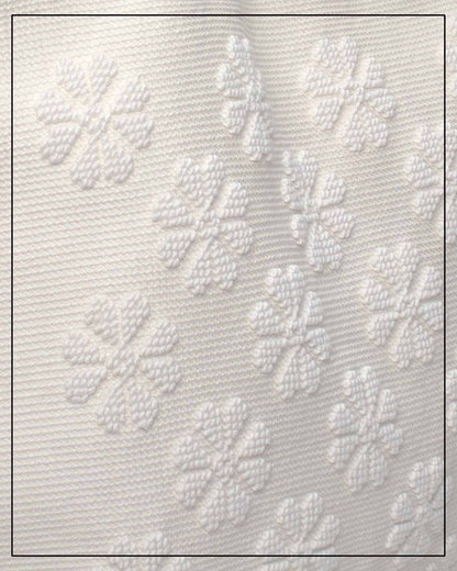 Textured white fabric with floral patterns by Antonello Tedde