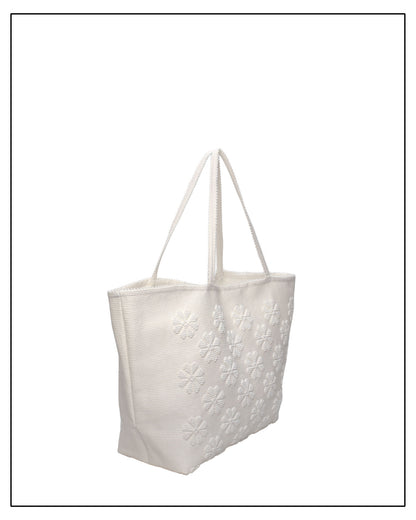 Raised flower pattern handwoven cream tote bag, all by Antonello Tedde