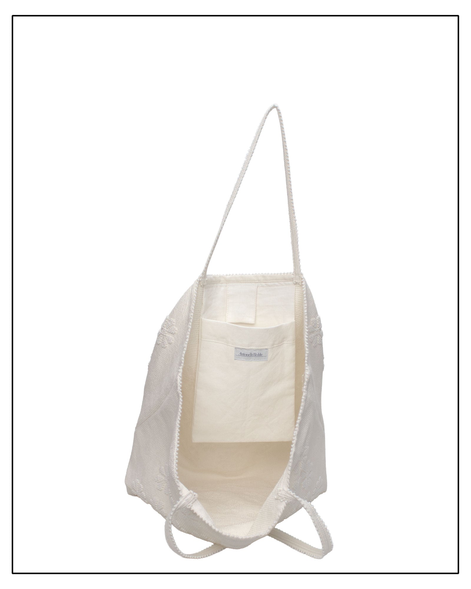 internal view of Raised flower pattern handwoven cream tote bag, all by Antonello Tedde