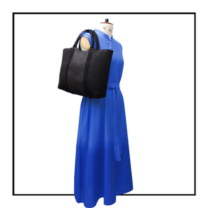 LISCIA Tro - Green and Black -tote-handbag- on mannequin with blue dress -eco-friendly-fashion-handbag-preserving-craft