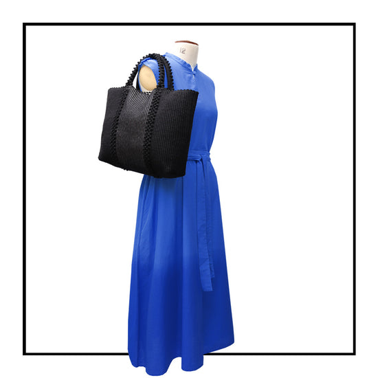 Quality eco-conscious tote back and silver with stripes of poms. Stylish clothes and Eco-Friendly with recycled yarns #luxury #ecoconcious #sustainablestyle  #ethicalbrands #ecoliving  #ecofashion #ecostyle #ethicalhandbags #handbags #sustainablelifestyle #ethicalfashion #sustainability