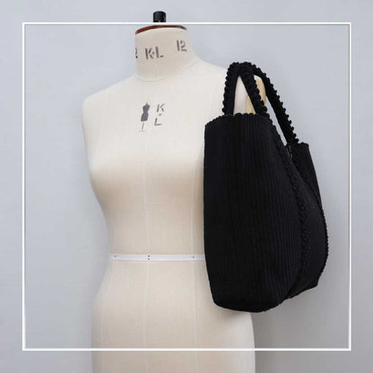 BLACK AND SILVER TOTE - LISCIA TRO - on mannequin - Ethical and Sustainable Handbags. The best eco luxury bags and accessories brand. Stylish clothes and Eco-Friendly with recycled yarns #luxury #ecoconcious #sustainablestyle #ethicalbrands #ethicalhandbags #handbags #sustainablelifestyle #ethicalfashion #sustainability