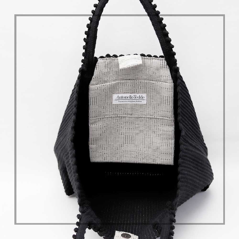 BLACK AND SILVER TOTE - LISCIA TRO - inside view with pocket -Ethical and Sustainable Handbags. The best eco luxury bags and accessories brand. Stylish clothes and Eco-Friendly with recycled yarns #luxury #ecoconcious #sustainablestyle #ethicalbrands #ethicalhandbags #handbags #sustainablelifestyle #ethicalfashion #sustainability