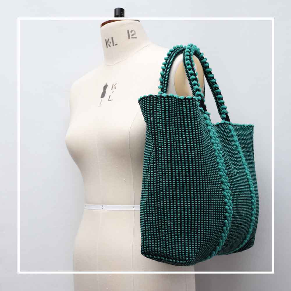 LISCIA Tro - Green and Black -tote-handbag- side view on mannequin -eco-friendly-fashion-handbag-preserving-craft