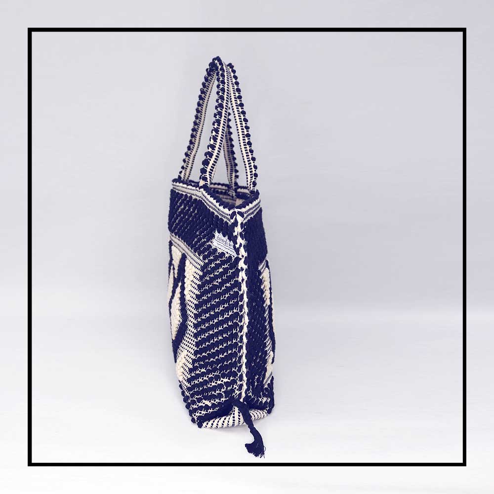 Side view of the handbag - Sustainable tote - summer bag - luxury handbag - handwoven black and white tote made in Italy by hand • timeless individualistic fashion • eco-friendly fashion • socially responsible, lasting fashion.